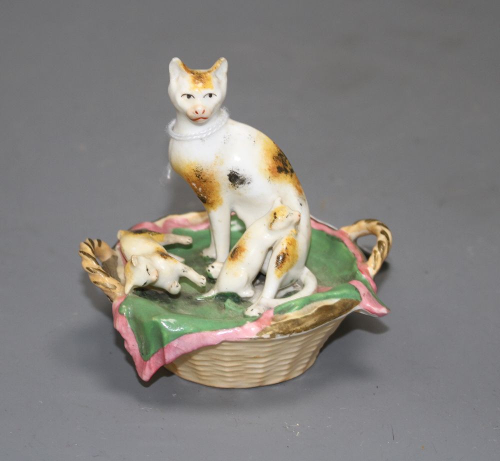 A Staffordshire porcelain group of a cat and two kittens in basket, c.1830-50, possibly Dudson,